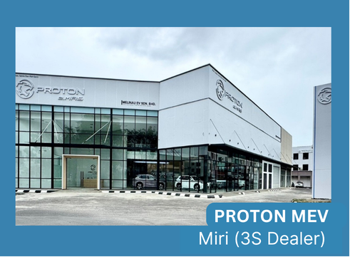 Front view of a Proton car dealership in Miri with a white, angular building and large glass storefronts.
